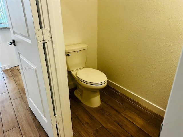 1672 SE 8th Ave, Homestead, FL 33034 - bathroom featuring hardwood / wood-style floors and a textured wall