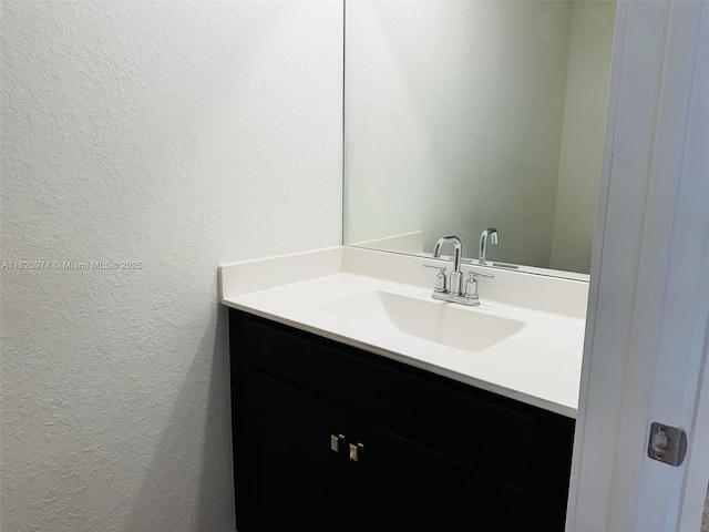 1672 SE 8th Ave, Homestead, FL 33034 - bathroom featuring a textured wall and vanity