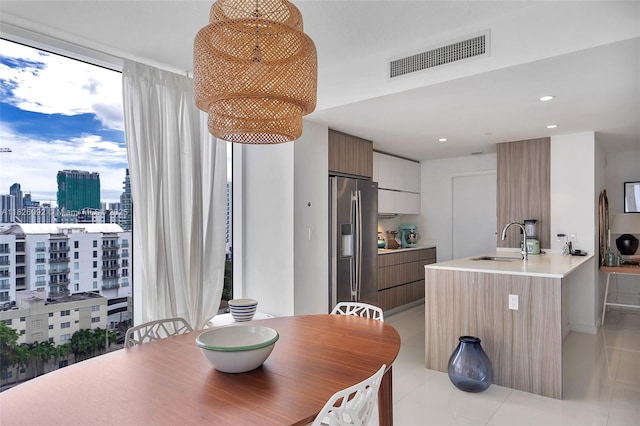 600 NE 27th St Unit 1105, Miami, FL 33137 - dining room with a view of city, light tile patterned floors, and recessed lighting