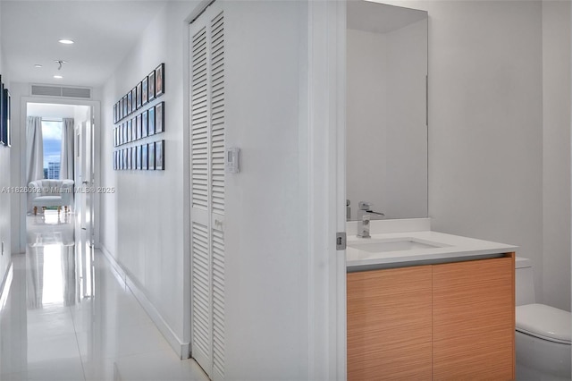 600 NE 27th St Unit 1105, Miami, FL 33137 - bathroom with vanity, tile patterned floors, recessed lighting, and a closet