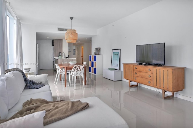 600 NE 27th St Unit 1105, Miami, FL 33137 - living area with light tile patterned floors and baseboards