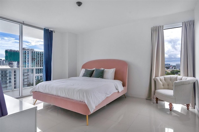 600 NE 27th St Unit 1105, Miami, FL 33137 - bedroom featuring a view of city and light tile patterned flooring
