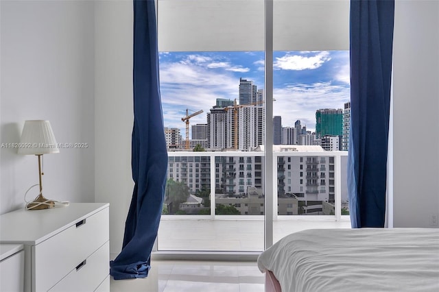 600 NE 27th St Unit 1105, Miami, FL 33137 - tiled bedroom featuring a view of skyline
