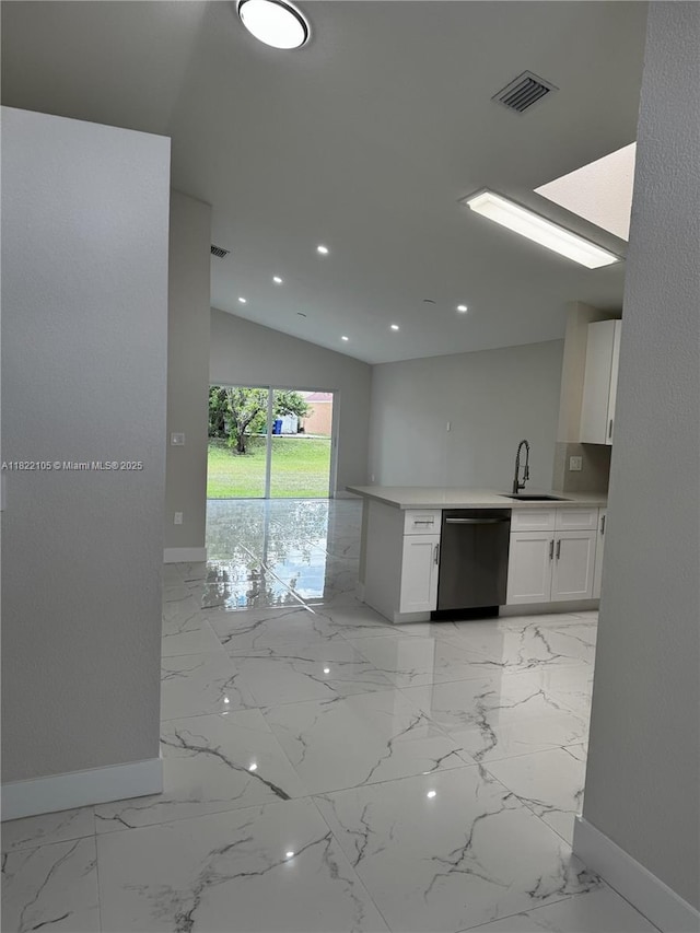 10000 Olive St, Miramar, FL 33025 - kitchen featuring dishwasher, white cabinets, light marble finish floors, light countertops, and recessed lighting