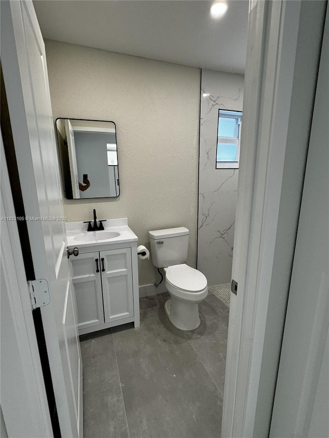 10000 Olive St, Miramar, FL 33025 - full bathroom featuring a marble finish shower, vanity, and unfinished concrete floors