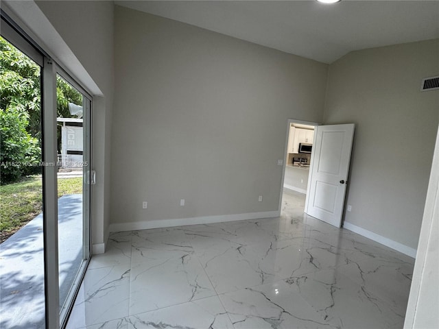 10000 Olive St, Miramar, FL 33025 - spare room featuring light marble finish flooring and high vaulted ceiling