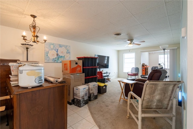 3126 Harbor Blvd Unit 1A, Port Charlotte, FL 33952 - living room featuring ceiling fan, light tile patterned floors, a chandelier, and light colored carpet