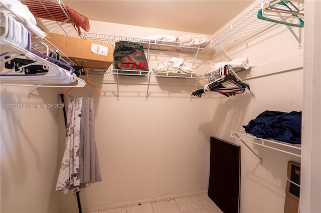 3126 Harbor Blvd Unit 1A, Port Charlotte, FL 33952 - walk in closet featuring light tile patterned floors