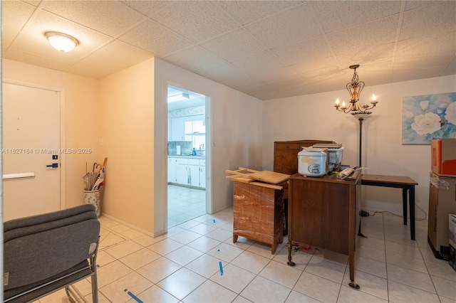 3126 Harbor Blvd Unit 1A, Port Charlotte, FL 33952 - home office with light tile patterned floors and a chandelier