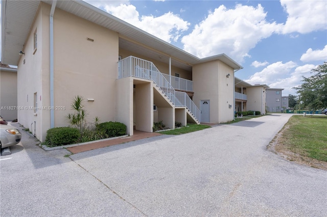3126 Harbor Blvd Unit 1A, Port Charlotte, FL 33952 - view of building exterior with stairs