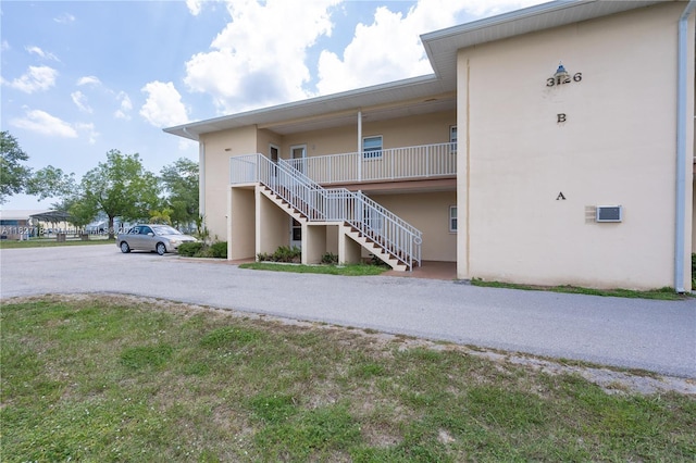 3126 Harbor Blvd Unit 1A, Port Charlotte, FL 33952 - view of building exterior with stairs