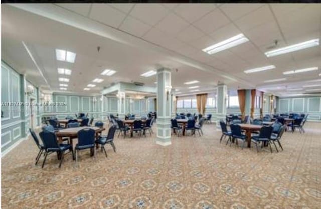 901 SW 128th Ter Unit 205A, Pembroke Pines, FL 33027 - carpeted dining room featuring decorative columns