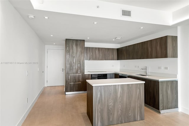 3131 NE 7th Ave Unit 2705, Miami, FL 33137 - kitchen featuring modern cabinets, a kitchen island, dark brown cabinetry, light countertops, and recessed lighting