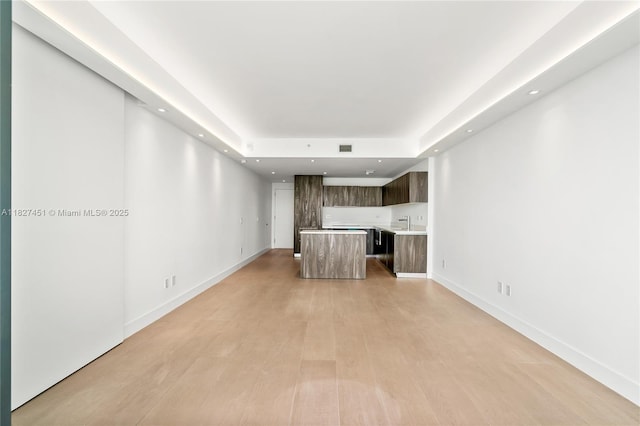 3131 NE 7th Ave Unit 2705, Miami, FL 33137 - unfurnished living room with recessed lighting, light wood finished floors, and a raised ceiling
