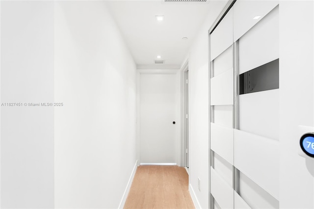 3131 NE 7th Ave Unit 2705, Miami, FL 33137 - hallway featuring light wood-style floors and recessed lighting