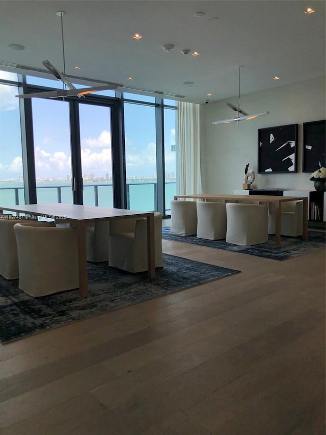 3131 NE 7th Ave Unit 2705, Miami, FL 33137 - living room featuring a water view, dark wood-style floors, recessed lighting, and expansive windows