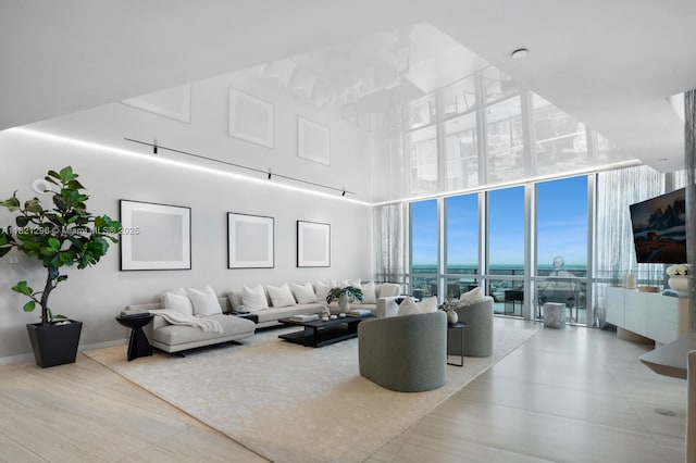 851 NE 1st Ave Unit 5202, Miami, FL 33132 - living area featuring expansive windows, a high ceiling, and wood finished floors