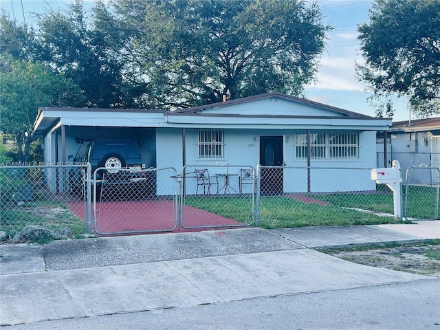 1905 NW 155th St, Miami Gardens, FL 33054 - view of front of home featuring a gate, a fenced front yard, an attached carport, and covered porch