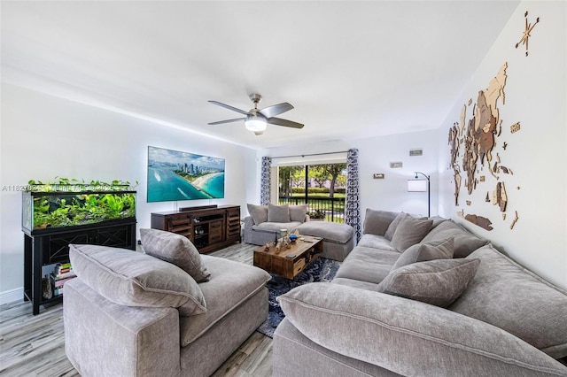 7925 SW 86th St Unit 903, Miami, FL 33143 - living room with ceiling fan and light wood-style floors