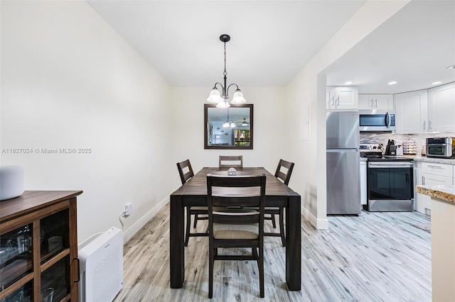 7925 SW 86th St Unit 903, Miami, FL 33143 - dining space featuring a chandelier, light wood-style floors, and recessed lighting