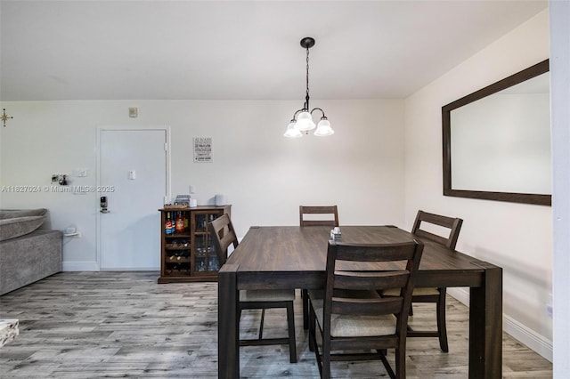 7925 SW 86th St Unit 903, Miami, FL 33143 - dining room with wood finished floors and a chandelier