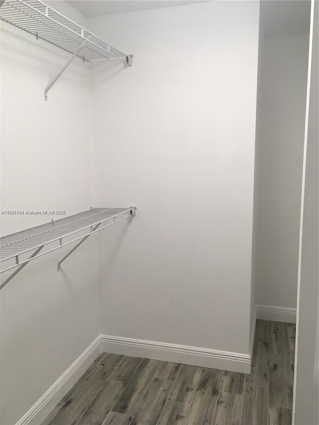 7925 SW 86th St Unit 903, Miami, FL 33143 - walk in closet featuring wood finished floors