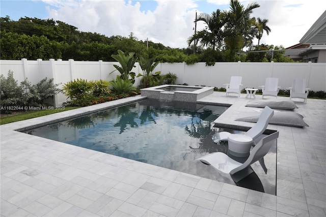 1321 Garfield St, Hollywood, FL 33019 - view of pool with a patio area, a fenced backyard, and a pool with connected hot tub