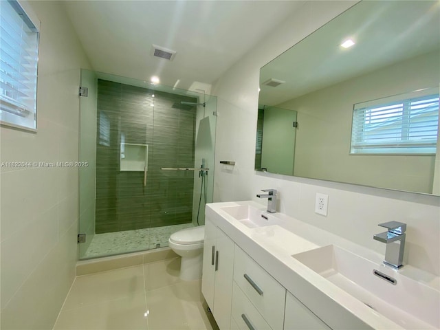 1321 Garfield St, Hollywood, FL 33019 - bathroom with tile patterned floors, a stall shower, and double vanity