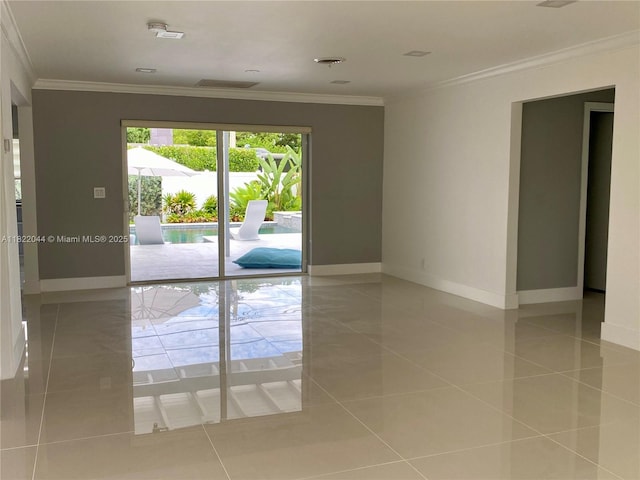 1321 Garfield St, Hollywood, FL 33019 - tiled spare room featuring baseboards and crown molding