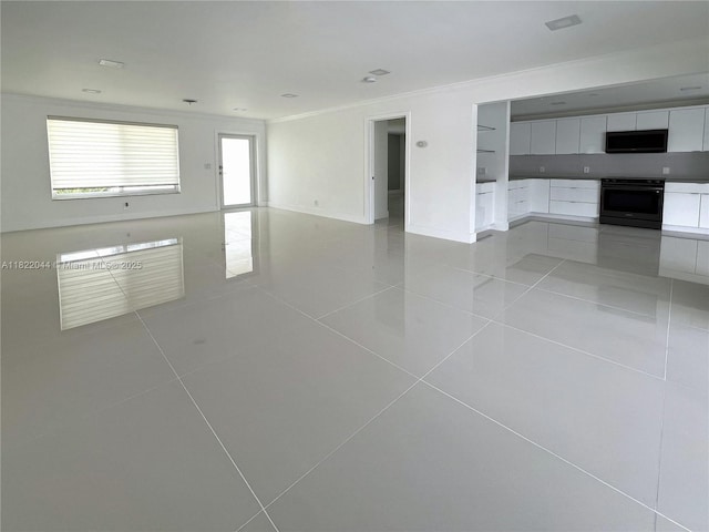 1321 Garfield St, Hollywood, FL 33019 - spare room featuring ornamental molding and light tile patterned flooring