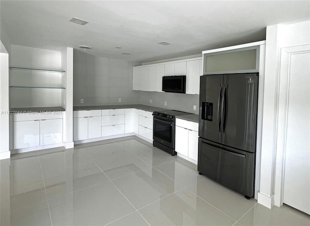 1321 Garfield St, Hollywood, FL 33019 - kitchen featuring black appliances, modern cabinets, white cabinets, and light tile patterned floors