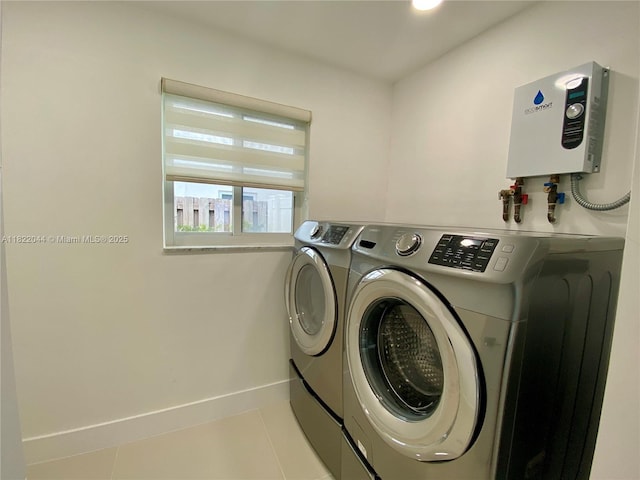 1321 Garfield St, Hollywood, FL 33019 - laundry area featuring washer and dryer, water heater, and tile patterned flooring