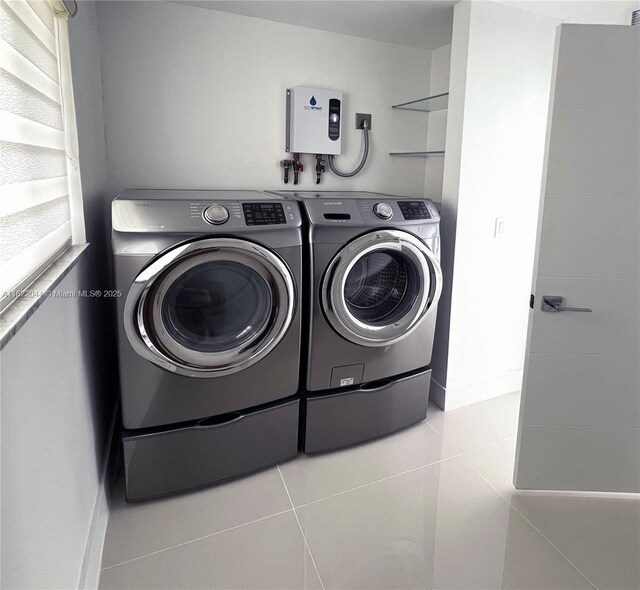1321 Garfield St, Hollywood, FL 33019 - laundry area with separate washer and dryer and tile patterned flooring