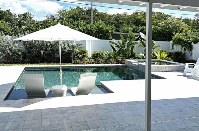 1321 Garfield St, Hollywood, FL 33019 - view of pool with a fenced backyard, a pool with connected hot tub, and a patio area