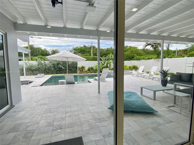 1321 Garfield St, Hollywood, FL 33019 - view of pool with a fenced backyard, a patio area, and a pool with connected hot tub