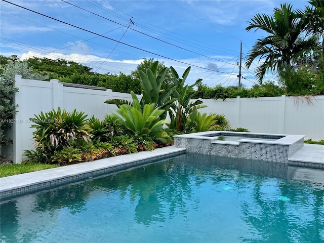 1321 Garfield St, Hollywood, FL 33019 - view of swimming pool featuring a fenced backyard and a pool with connected hot tub
