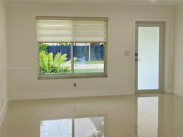 1321 Garfield St, Hollywood, FL 33019 - spare room with tile patterned flooring and ornamental molding