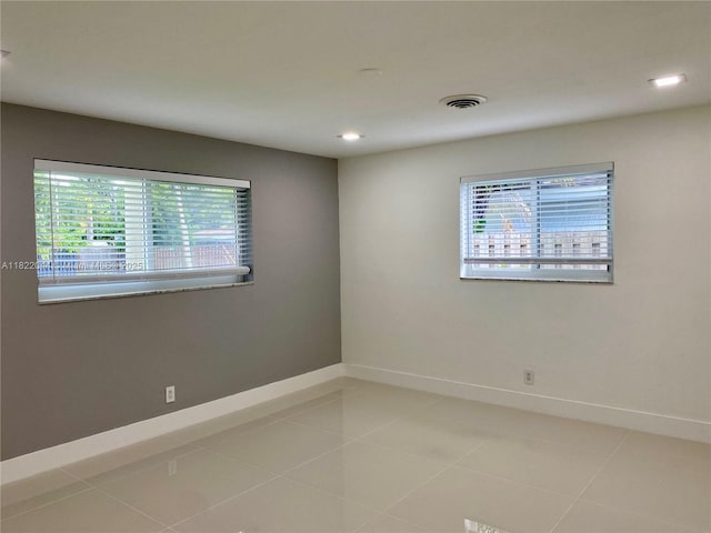 1321 Garfield St, Hollywood, FL 33019 - unfurnished room with healthy amount of natural light, light tile patterned floors, and recessed lighting