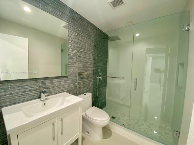 1321 Garfield St, Hollywood, FL 33019 - bathroom with tile walls, a shower stall, backsplash, and vanity