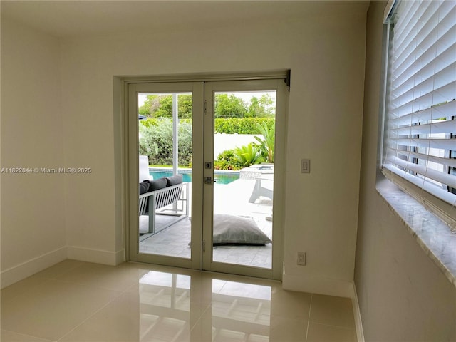 1321 Garfield St, Hollywood, FL 33019 - doorway to outside with french doors and tile patterned floors