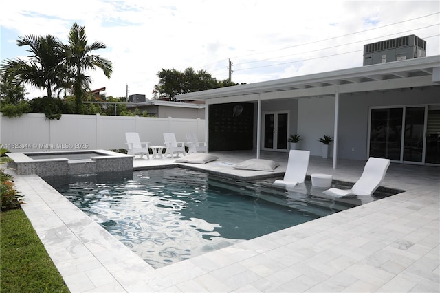 1321 Garfield St, Hollywood, FL 33019 - view of pool with french doors, a patio area, and a pool with connected hot tub