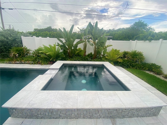 1321 Garfield St, Hollywood, FL 33019 - view of swimming pool featuring a fenced backyard and an in-ground hot tub