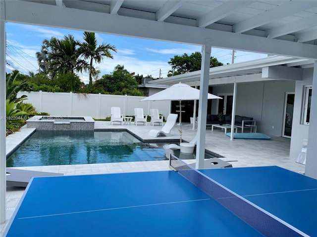 1321 Garfield St, Hollywood, FL 33019 - view of swimming pool featuring an in-ground hot tub, a fenced backyard, and a patio area