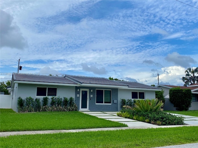 1321 Garfield St, Hollywood, FL 33019 - ranch-style home featuring a front lawn and stucco siding