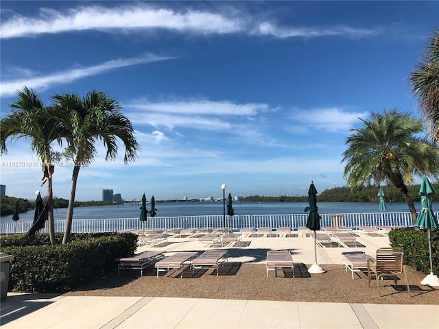 300 Bayview Dr Unit 1009, Sunny Isles Beach, FL 33160 - view of swimming pool featuring a patio area and a water view