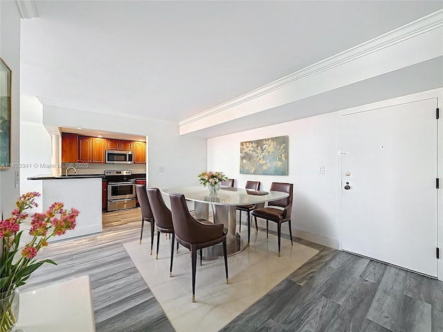 dining room with light wood-style flooring