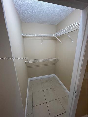 5780 Rock Island Rd Unit 354, Tamarac, FL 33319 - spacious closet with tile patterned flooring