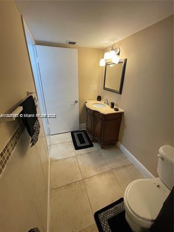 5780 Rock Island Rd Unit 354, Tamarac, FL 33319 - bathroom with vanity and tile patterned flooring