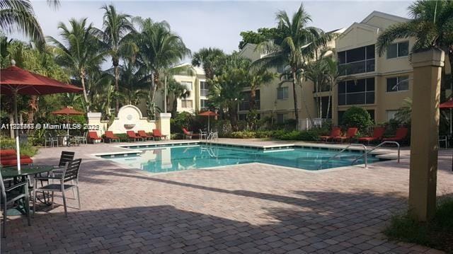 5780 Rock Island Rd Unit 354, Tamarac, FL 33319 - community pool featuring a patio