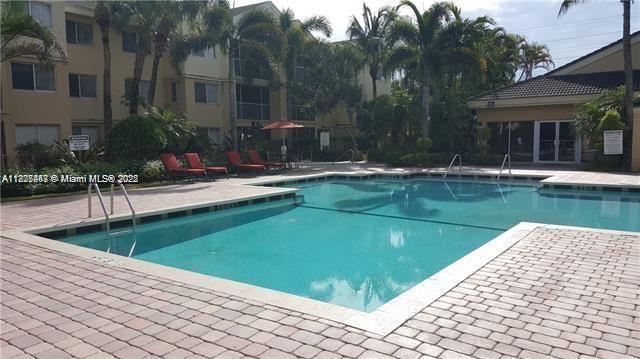 5780 Rock Island Rd Unit 354, Tamarac, FL 33319 - community pool featuring a patio